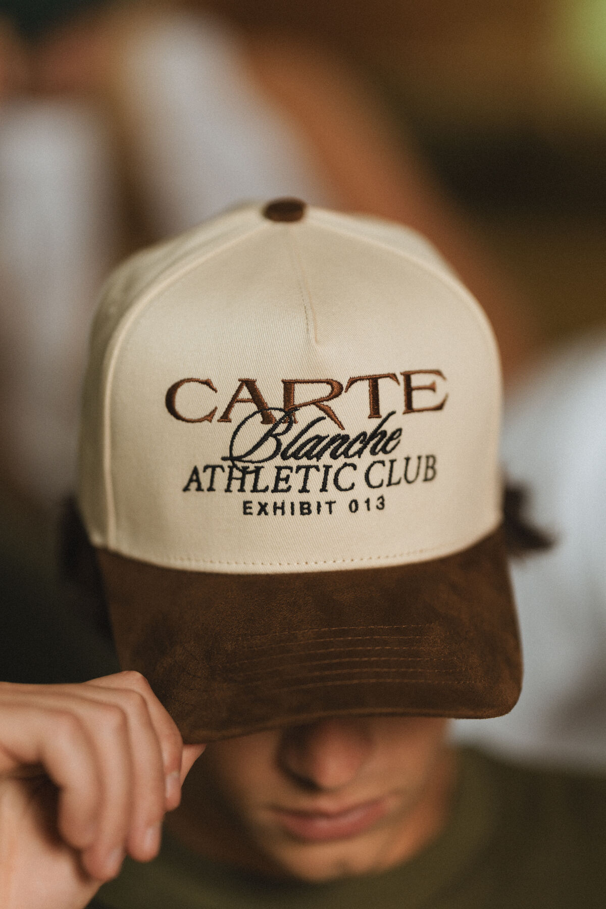 Carte Blanche 013 product detail — layered streetwear styling with earth-tone palette
