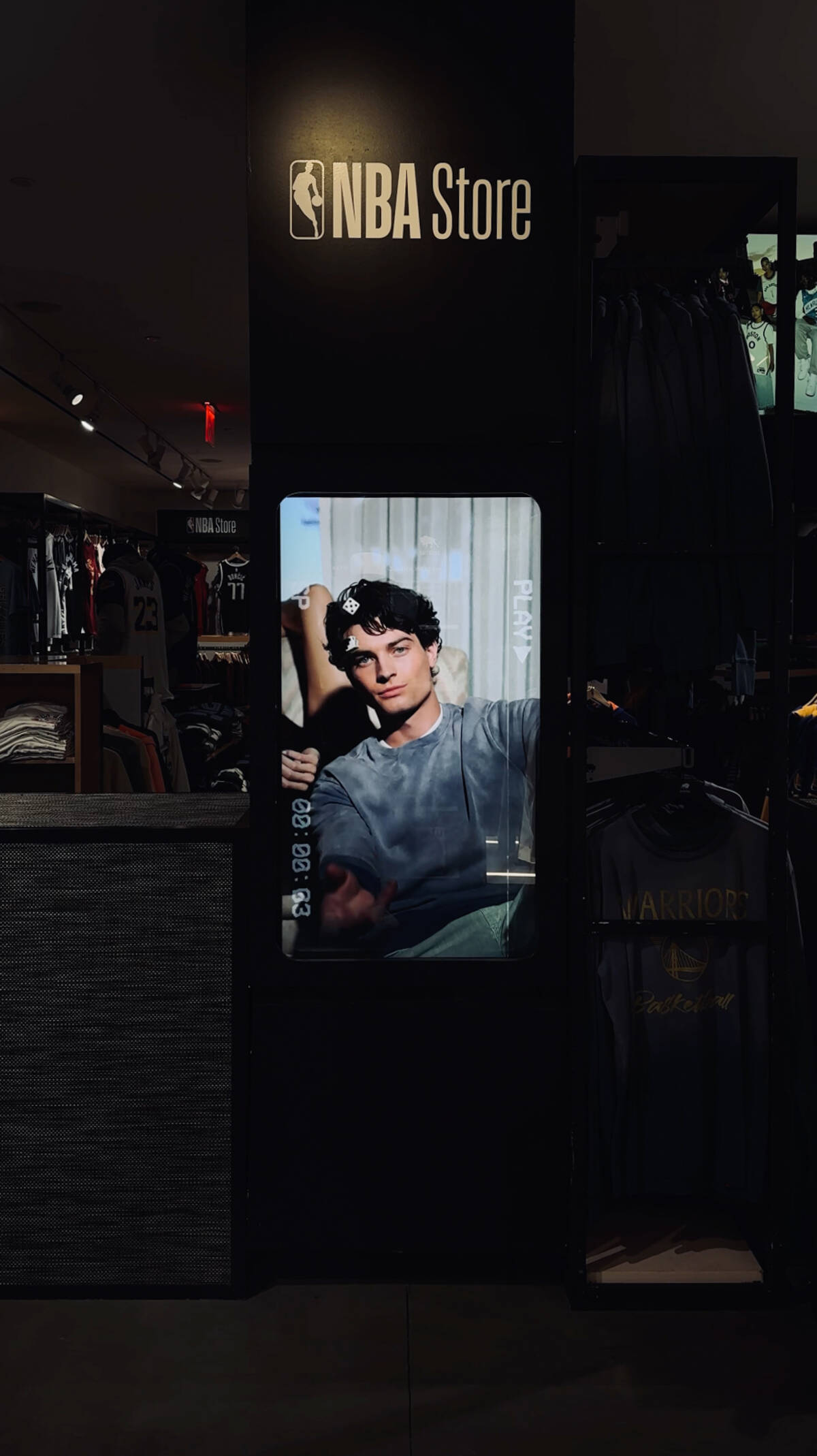 AUG11 campaign film playing on a screen inside the NBA Store