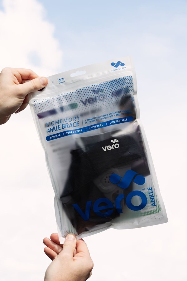 Vero ankle brace packaging held up for a product shot, final delivered asset