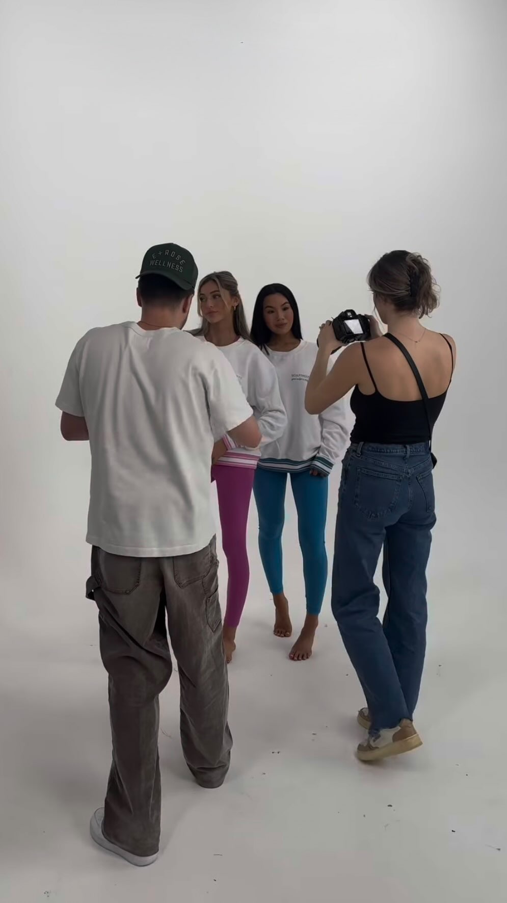 Trainer coaching a client mid-set, frame from the SculptHouse brand film